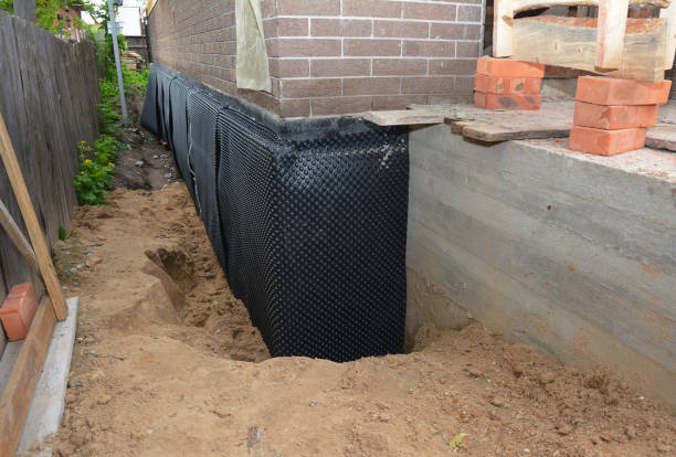 Happy homeowners after waterproofing job in Lynx